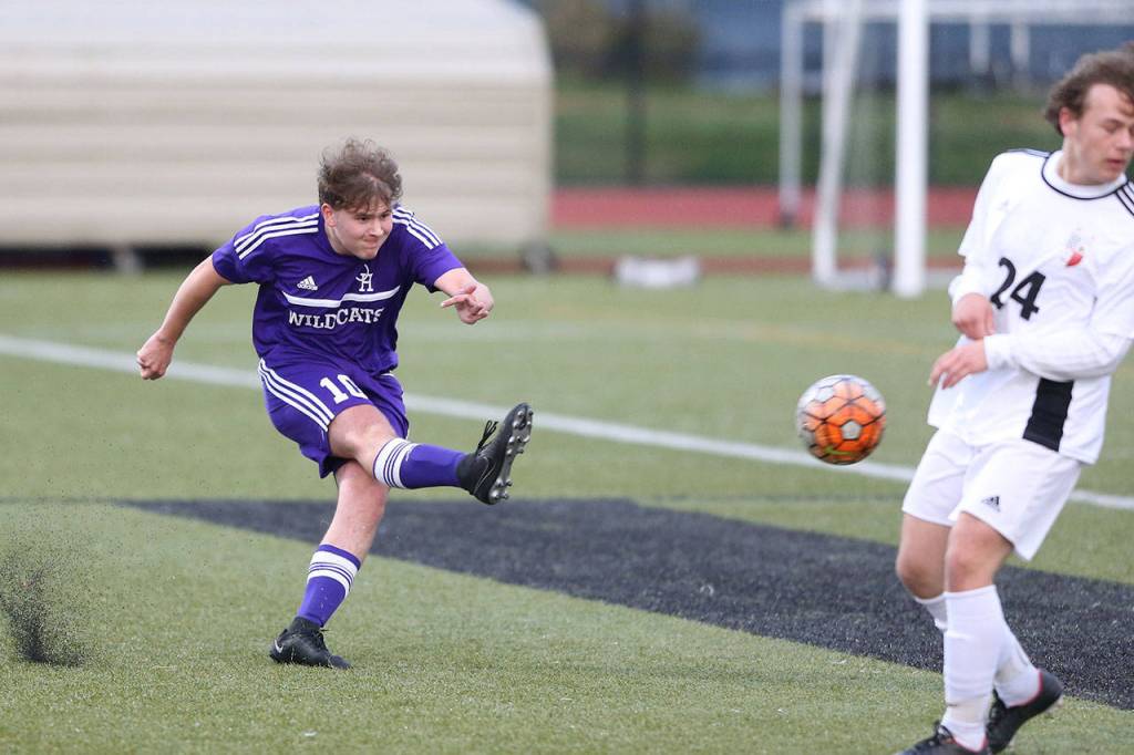 Julian Hinkle blasts a kick by Snohomishs John Flores. (Photo by John Fisken)