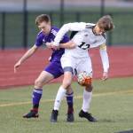 Oak Harbors Nathan Merrill, left, tangles with Tate French.(Photo by John Fisken)
