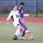 Oak Harbors Taiveyon Shaw battles Finn Torre for possession.(Photo by John Fisken)