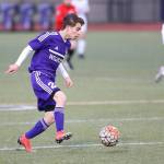 Jonathan Tang dribbles the ball up the field for Oak Harbor. (Photo by John Fisken)