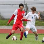 Jonathan Partida examines the field for an open teammate.(Photo by John Fisken)