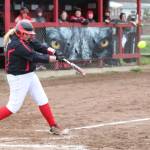 Coupevilles Veronica Crownover thumps a first-inning grand slam to jump start the Wolves offense Tuesday. (Photo by John Fisken)