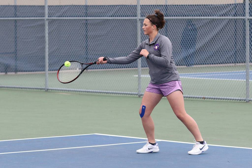 Olivia Lerch volleys in first doubles.(Photo by John Fisken)