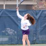 Annie Salinger puts the ball in play in third singles.(Photo by John Fisken)
