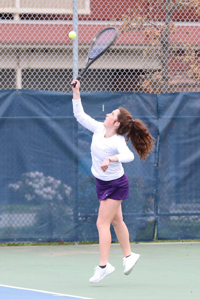 Annie Salinger puts the ball in play in third singles.(Photo by John Fisken)