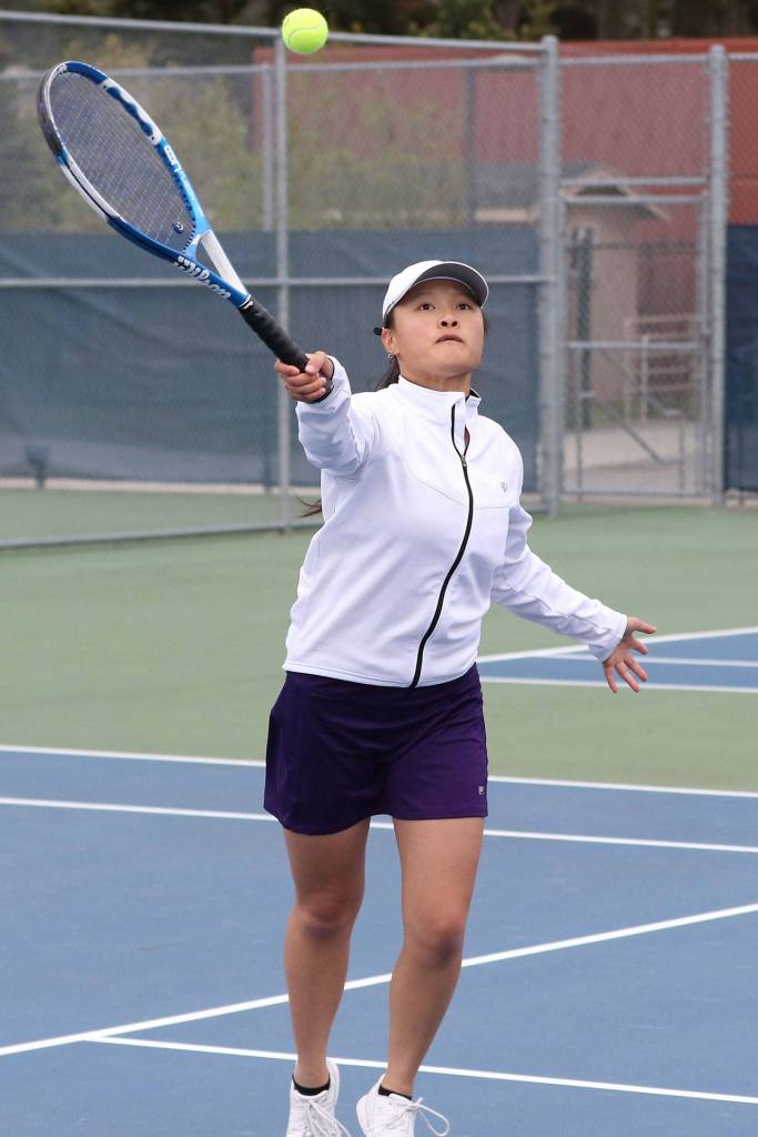 MJ Timm runs down a shot in her win in first singles.(Photo by John Fisken)