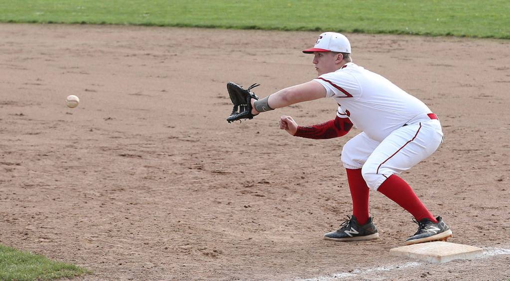 Dane Lucero records a force out at first base.(Photo by John Fisken)