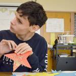 Community members holding A Night to Remember