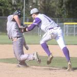 Taylor Rummel tags a Marysville-Pilchuck base runner.(Photo by John Fisken)