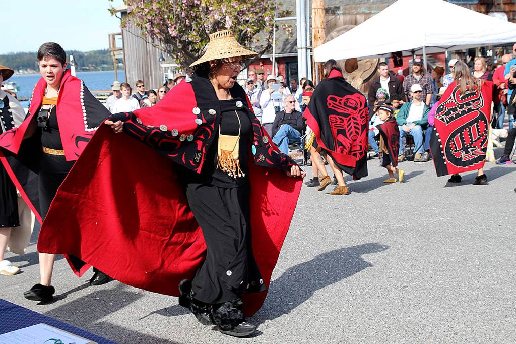 (Photo by Maria Matson/Whidbey News-Times)                                The Tsimshian Haayuuk Dancers weave and spin in a dance at the center of a captivated crowd at the Penn Cove Water Festival. A speaker discussed the symbolism of their cultural garb and spoke of the significance of the traditional dance