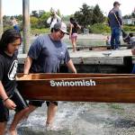 (Photo by Maria Matson/Whidbey News-Times)                                For the canoe pullers the hard work doesnt stop when the race is over. Each team, including this team with the Swinomish tribe, hauls their sturdy canoes out of the water and to their vehicles to make way for the next competing teams. Paddlers train for months in preparation for the competition.