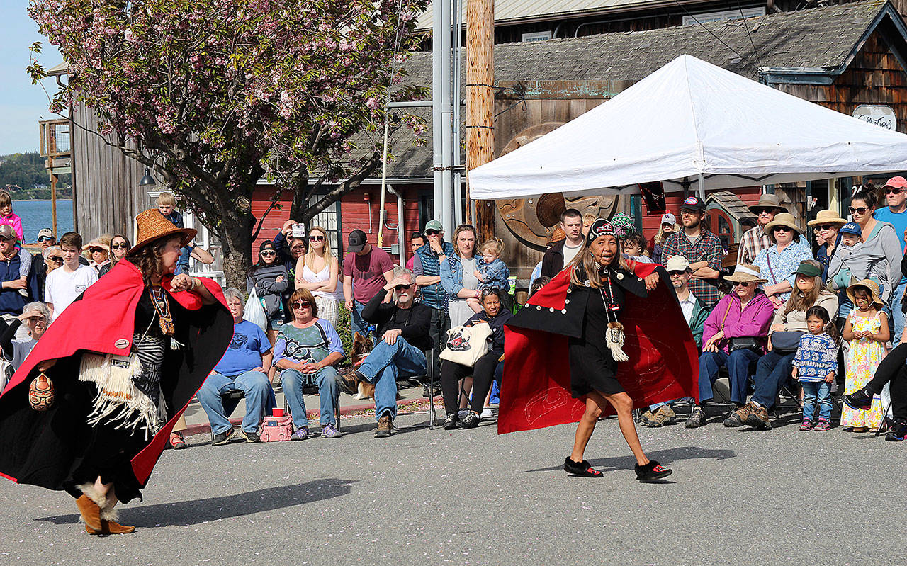 The Tsimshian Haayuuk Dancers weave and spin in a dance at the center of a captivated crowd at the Penn Cove Water Festival. A speaker discussed the symbolism of their cultural garb and spoke of the significance of the traditional dance                                (Photo by Maria Matson/Whidbey News-Times)