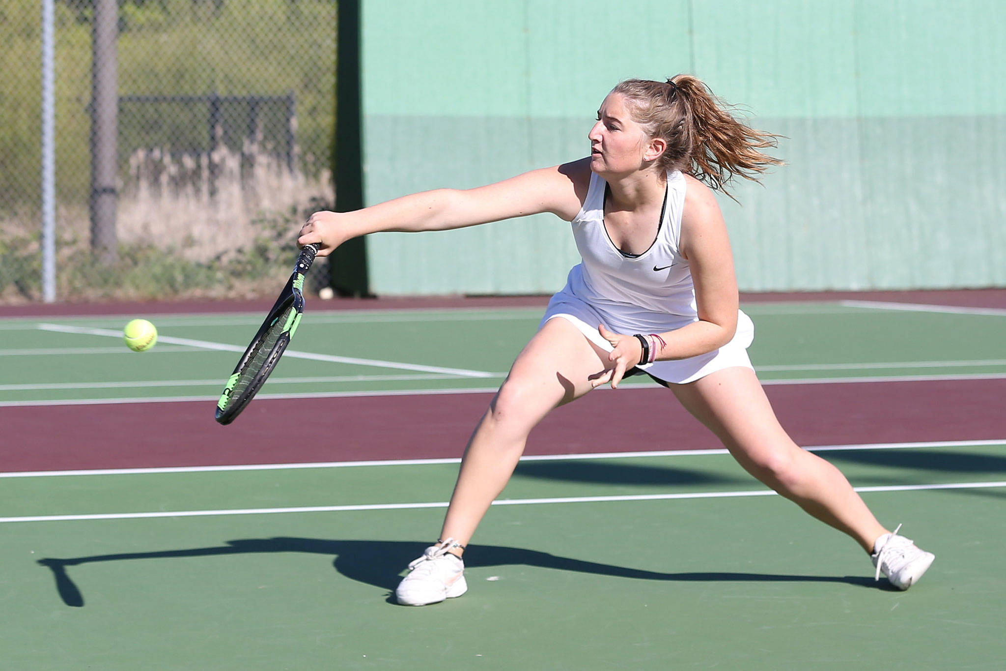 Coupevilles Tia Wurzrainer runs down a shot in her win in first doubles Tuesday.(Photo by John Fisken)