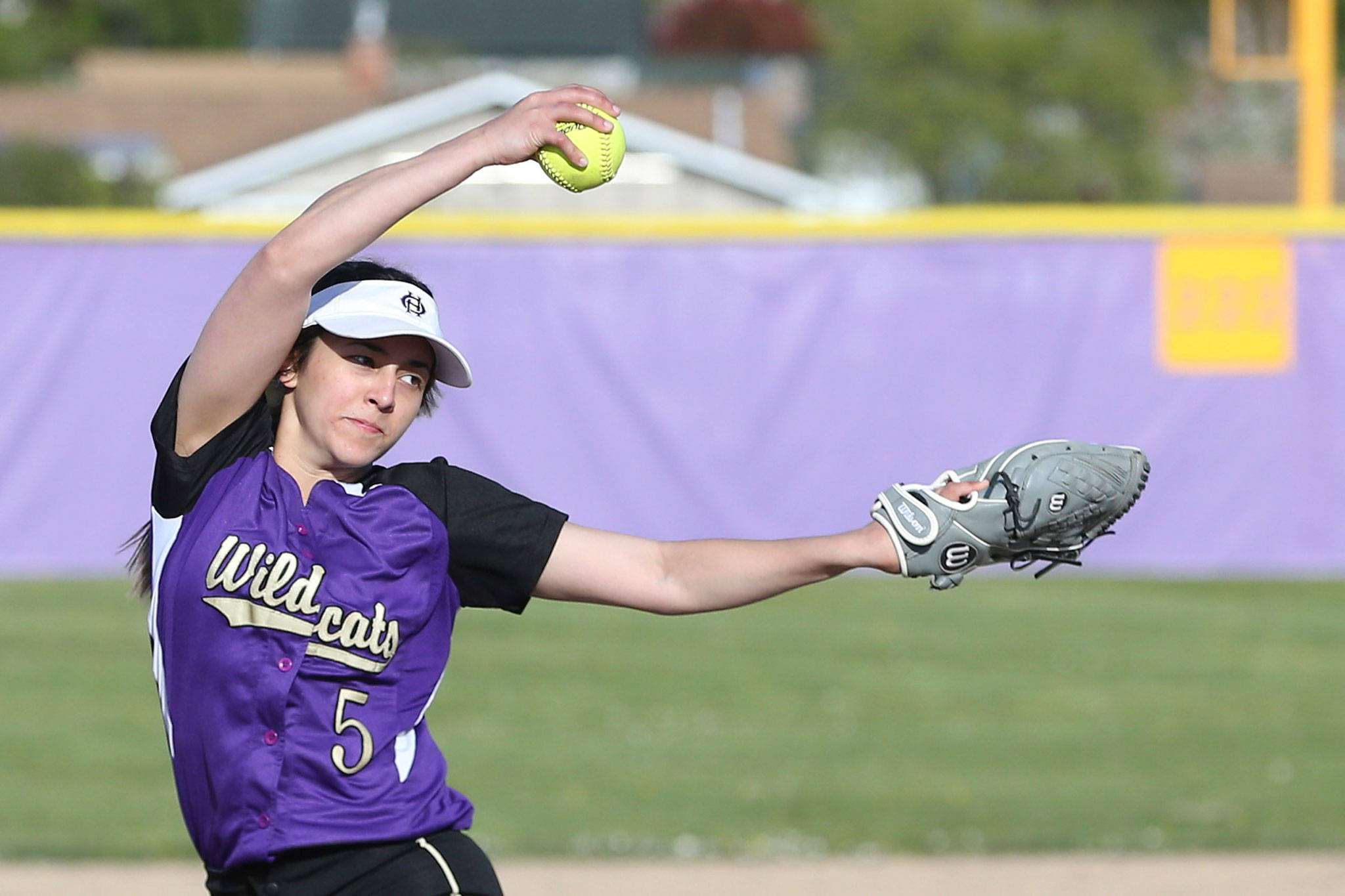 Oak Harbors Cierra LeGendre unloads a pitch in Tuesdays game with Arlington. The senior did most of her damage at the plate, slugging a double and home run to set a new school single season record for hits.(Photo by John Fisken)
