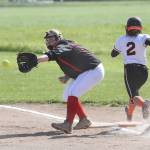 Veronica Crownover reaches for a throw as Granite Falls Alexis Grime races to first base.(Photo by John Fisken)