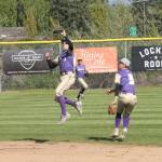 Oak Harbor shortstop Noah Meffert jumps to snag a line drive as second baseman Gage McLeod and left fielder Caleb Fitzgerald look on. (Photo by Jim Waller/Whidbey News-Times)