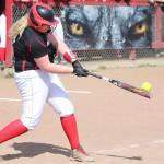Wolves win twice; now tied for league lead / Softball