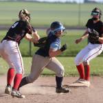 Coupeville shortstop Chelsea Prescott tags out a Sultan runner as second baseman Scout Smith looks on.(Photo by John Fisken)