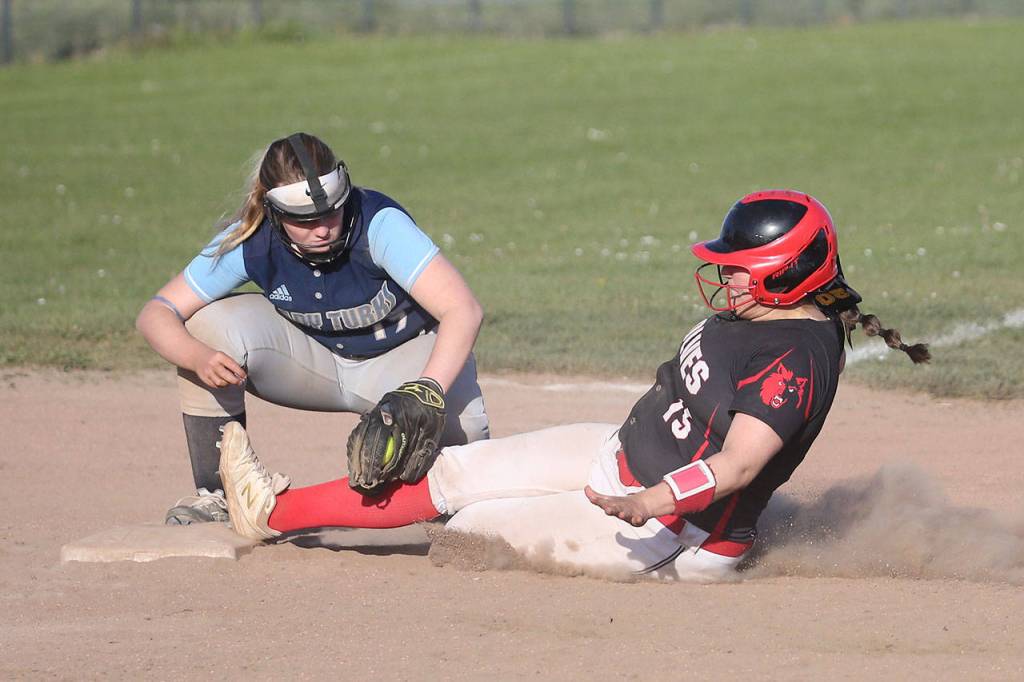 Sarah Wright slides safely into third base.(Photo by John Fisken)