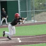 Matt Hilborns bunt moves up a runner against Meridian. (Photo by Jim Waller/Whidbey News-Times)