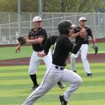 Dane Lucero fields a bunt and throws to first base for an out.(Photo by Jim Waller/Whidbey News-Times)