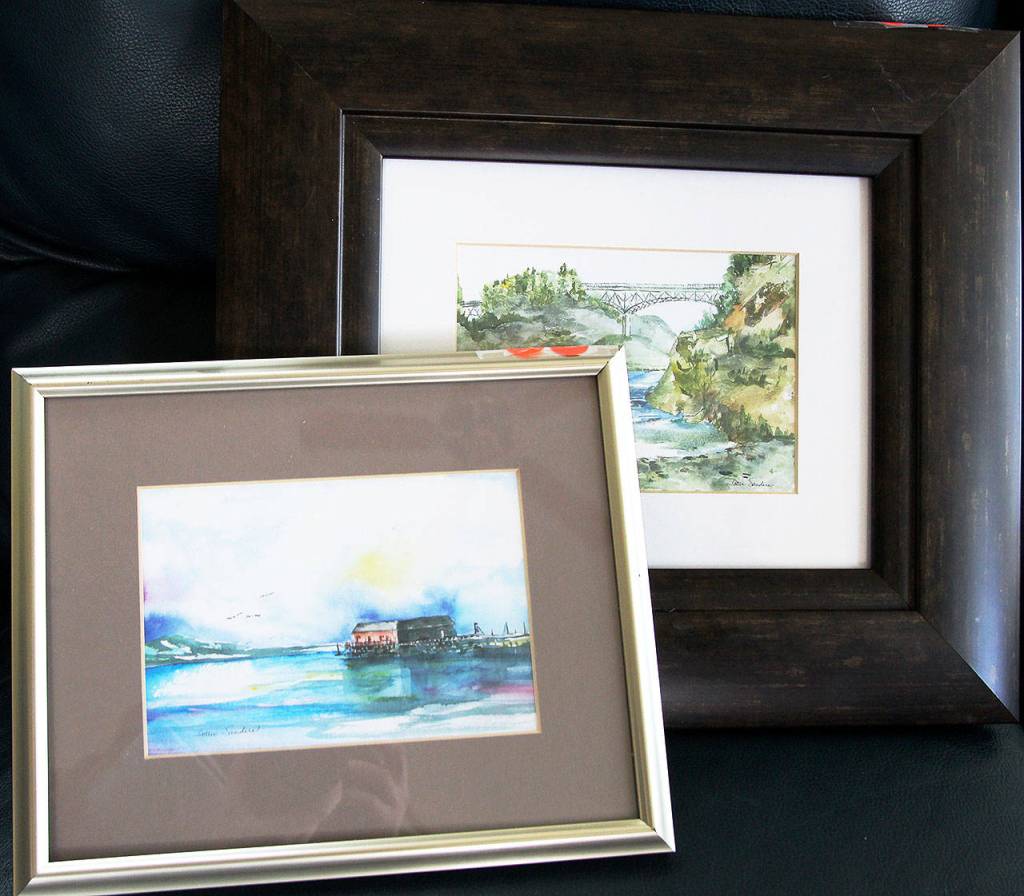 Watercolors by Dottie Sanders of the Coupeville Wharf and Deception Pass Bridge.