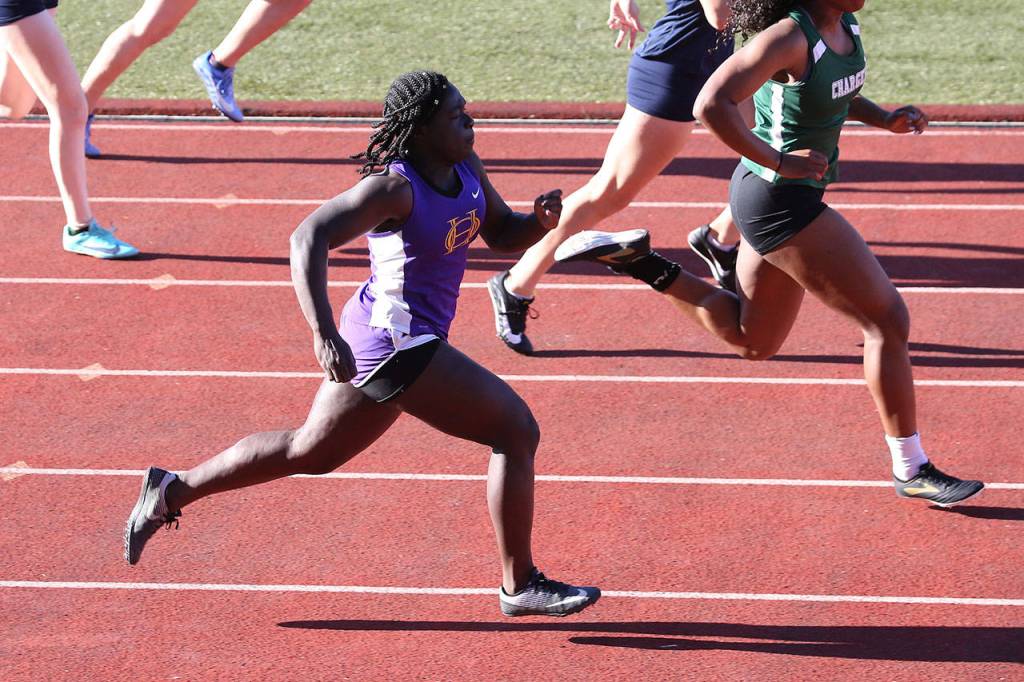 Maria Dailey runs to fifth place in the 100 meters.(Photo by John Fisken)