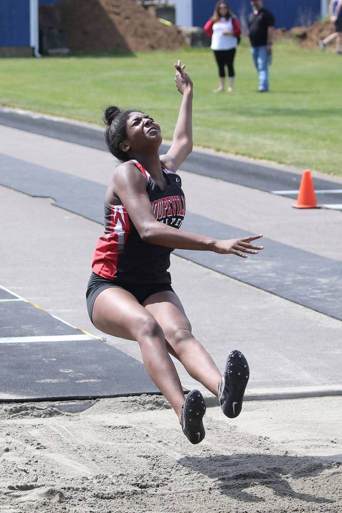 JaKenya Hoskins flies in the long jump.(Photo by John Fisken)