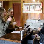 Photo by Patricia Guthrie/Whidbey News Group                                Whidbey Island Distillery spirits guide Michelle Molner serves Katie Kreitzer, left, and Johanna Kreitzer, visitors from Minnesota that stopped in for a tasting Monday.