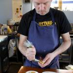 Photo by Patricia Guthrie/Whidbey News Group                                Trap Landry, chef and co-owner of Anthes Ferments in Langley, fills french-style cheese pastries with his mix of nettle pistachio pesto that will be paired with Comforts of Whidbey High Tide White. Hell be making 300 for this weekends Savor Spring Food, Wine Spirits Tour.