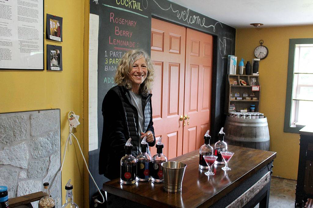 Photo by Patricia Guthrie/Whidbey News Group                                Whidbey Island Distillery spirits guide Michelle Molner pours two speciality craft cocktails for customers. Its releasing Lavender Infused Loganberry Liqueur as part of its Savor Spring offerings.