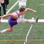 Gabriel Daggett runs the 110 hurdles for Oak Harbor. (Photo by John Fisken)