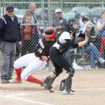 Sarah Wright slides by the Merdian catcher for a Coupeville run.(Photo by Jim Waller/Whidbey News-Times)