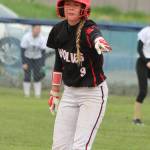 Chelsea Prescott points out the hole that tripped her while she was running to second base for a double. (Photo by Jim Waller/Whidbey News-Times)