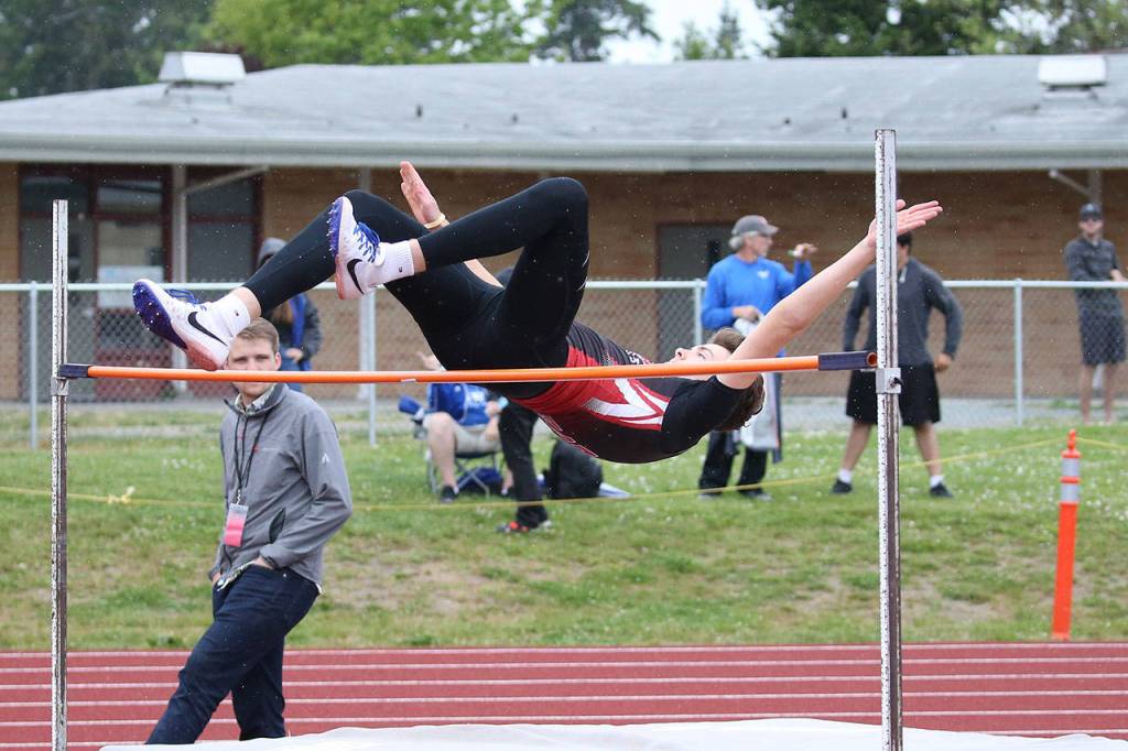 Koa Davisson floats over the high jump bar.(Photo by John Fisken)