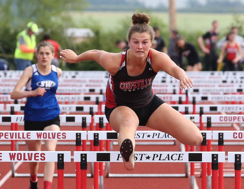 Lindsey Roberts breaks her school record in the 100 hurdles.(Photo by John Fisken)