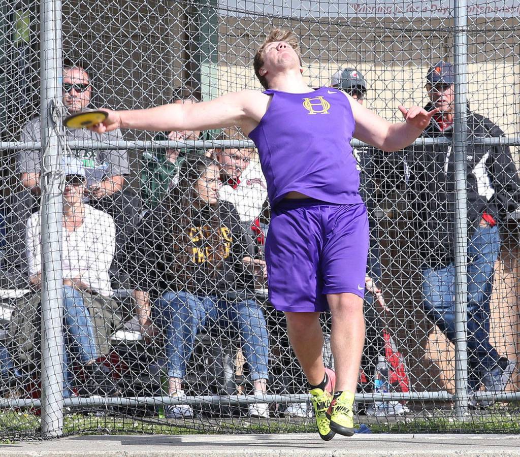 Michael Fisken throws his way to the state meet by placing fourth in the discus.(Photo by John Fisken)