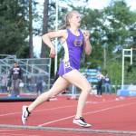 Natalie French runs down the home stretch and into the state meet by placing third in the district 800 meters. (Photo by John Fisken)