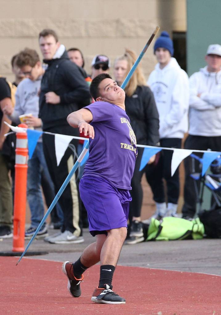 Michael Gomez fires the javelin for Oak Harbor. Gomez placed eighth in the event and fifth in the discus at district.(Photo by John Fisken)