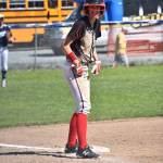 Chelsea Prescott is all smiles after a dirty landing into third base.(Photo by Karen Carlson)