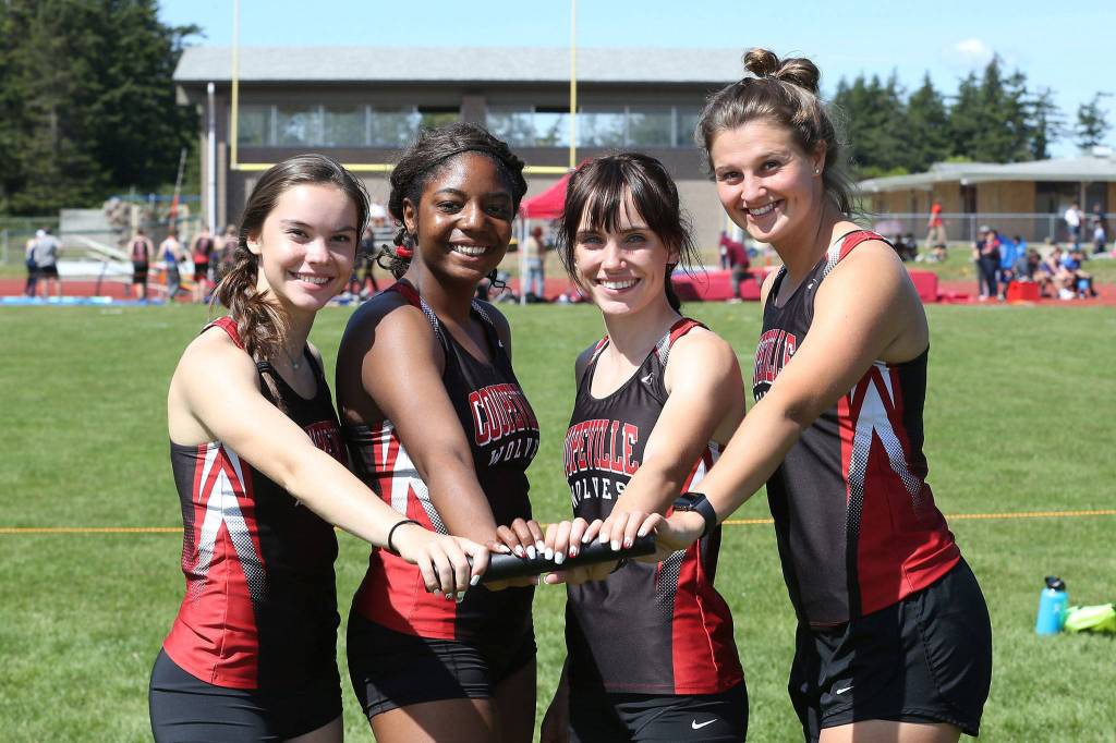 The Wolves 4x10 team of Maya Toomey-Stout, JaTarya Hoskins, Mallory Kortuem and Lindsey Roberts qualied for the state meet. (Photo by John Fisken)