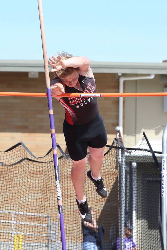 Kyle Burnett competes in the pole vault for the Wolves.(Photo by John Fisken)