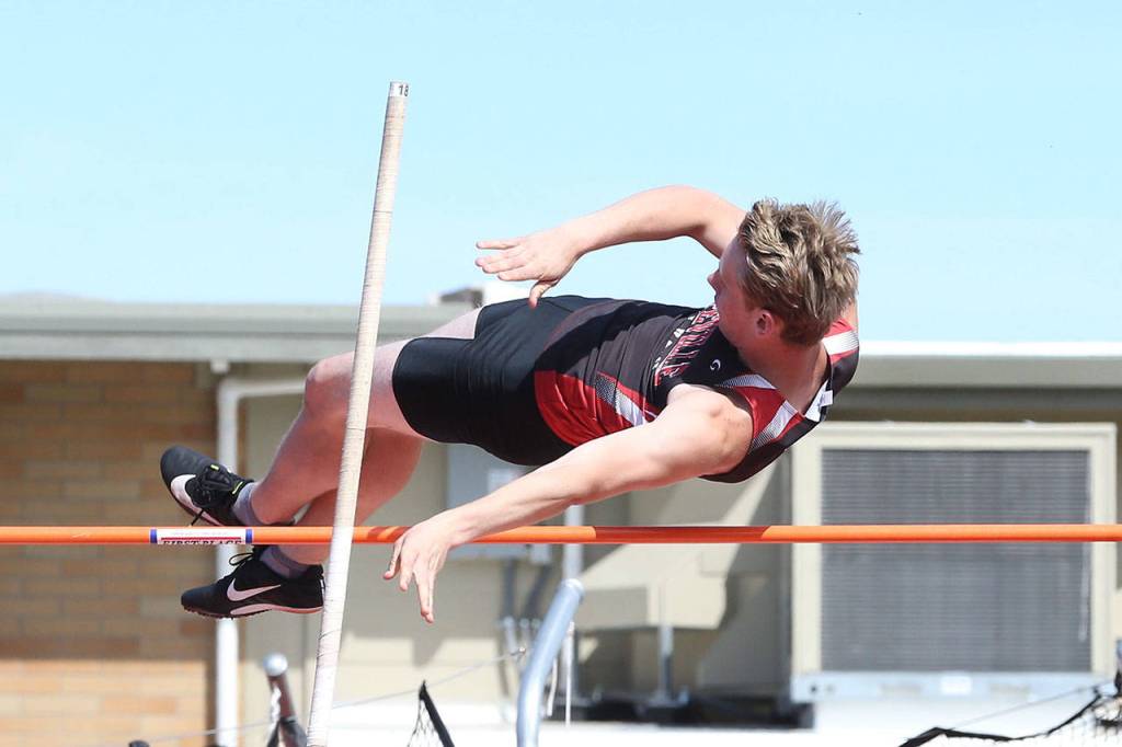 Tiger Johnson floats over the bar in the pole vault.(Photo by John Fisken)
