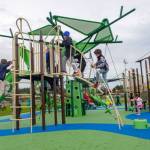 U.S. Navy photo                                Sailors and their families familiarize themselves with the reconstructed playground area at Costen-Turner Memorial Park located on Ault Field at Naval Air Station Whidbey Island.