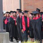 Seniors, including smiling graduate Jaushon Clay, center, line up before entering the gymnasium Friday evening. Photo by Maria Matson/Whidbey News-Times