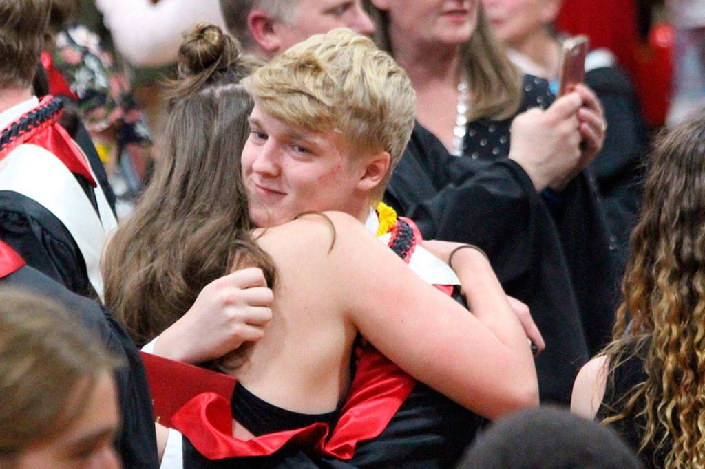 Jaschon Baumann hugs his friend. Photo by Maria Matson/Whidbey News-Times