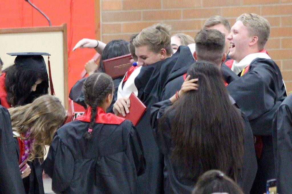 Its hugs, tears and cheers for the graduating class as they enter their new lives post-high school. Photo by Maria Matson/Whidbey News-Times