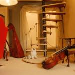 Throughout the house, there are several cats looking content.