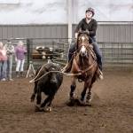 Katie Houck ropes a calf in a recent competition. (Photo by Laura Houck)