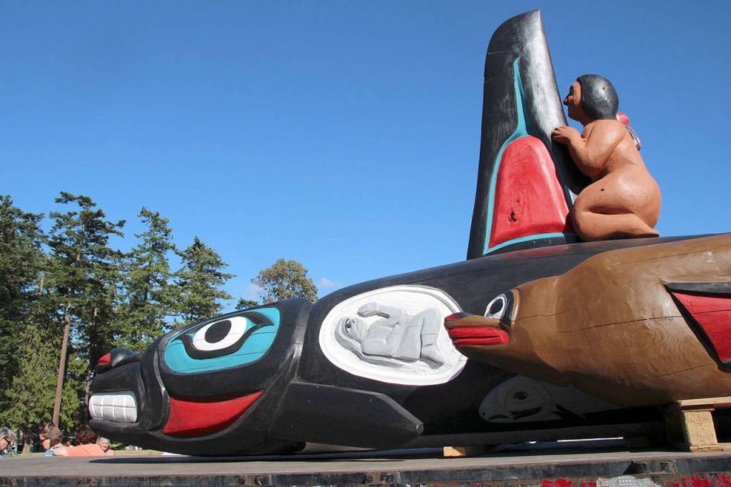 The Tokitae Totem Pole has traveled many miles on the journey from Florida to Penn Cove. Tokitae, also called Lolita, is now dubbed another name. The name SkaliChelh-tenaut comes from a tribal village that once stood in Penn Cove, according to Lummi tribal members. (Photo by Maria Matson/Whidbey News-Times)